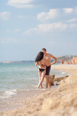 Romantic couple kissing on seashore