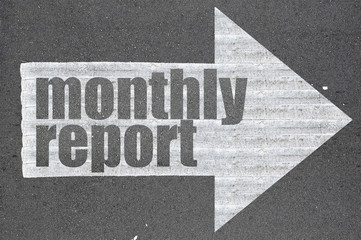 Arrow on asphalt road written word monthly report - 98921418