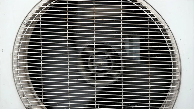 A running exhaust fan on the wall. Ceiling fans do not provide ventilation as defined as the introduction of outside air.