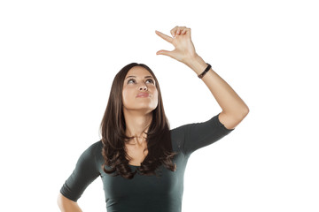 smiling young woman holding an imaginary object in her hand