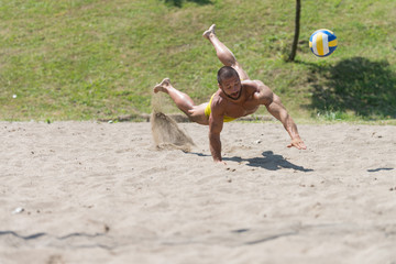 Male Beach Volleyball Game Player Jump On Sand