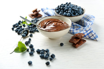 Beautiful composition with chocolate cream and blueberries