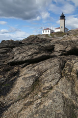 Fototapeta na wymiar Explore Beavertail Lighthouse on Unique Rock Formations in Rhode Island