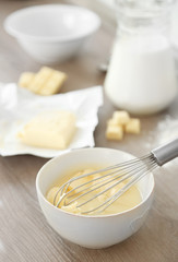 Cooking buttery cream on kitchen