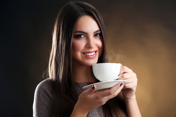 Portrait of pretty woman with cup of coffee