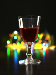 Wine glass with bokeh on dark background