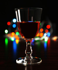 Wine glass with bokeh on dark background