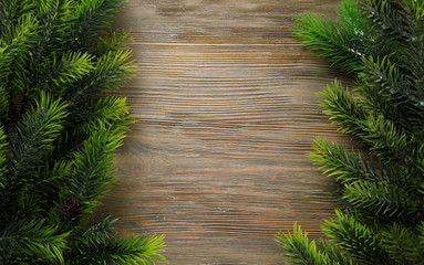 Christmas fir tree branches on wooden table