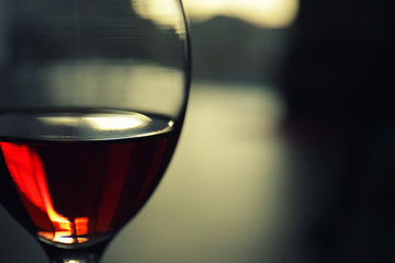 Glass of red wine on blurred background