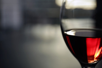 Glass of red wine on blurred background