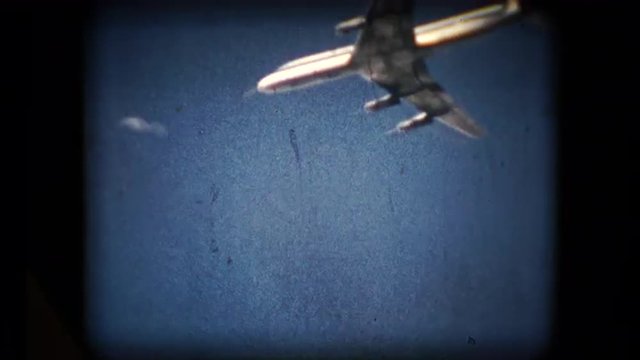 Scene of a plane flying overhead in the mid 1960's