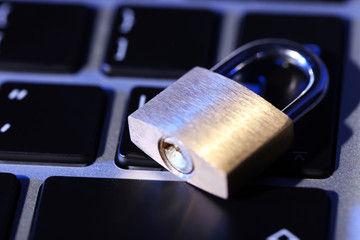 Cyber safety concept - lock on computer keyboard