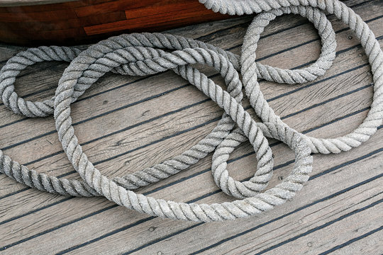 Coiled rope on a wooden deck