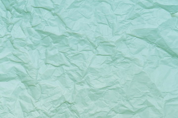 Fototapeta na wymiar Close-up of blue-green paper showing texture 
