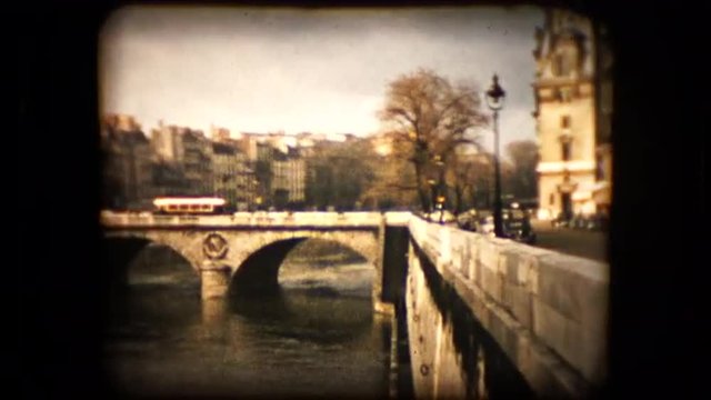 Historic footage of a bridge over the Seine river in Paris