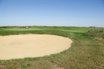 Naklejka premium Sand bunker on the golf course