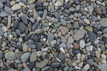 Pebbles and pea gravel, suitable for use as a background or texture