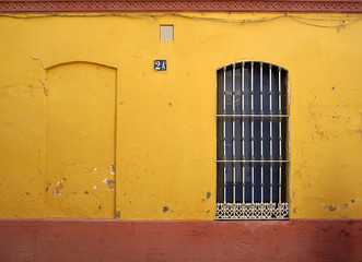 window frame on the yellow wall