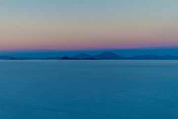 Fototapeta na wymiar Sunrise on Salar de Uyuni salt flat, Bolivia