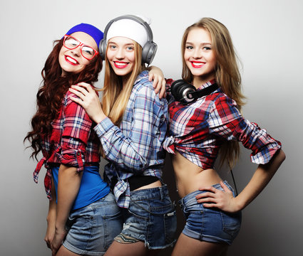 Three stylish sexy hipster girls best friends.