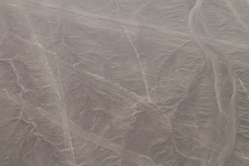 Aerial view of geoglyphs near Nazca - famous Nazca Lines, Peru. In the center, small Dog figure is...