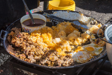 Meal prepared at a traditional Saturday market in a remote village Zumbahua, Ecuador