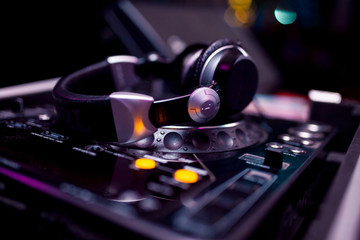 Fototapeta na wymiar Headphones on the DJ board