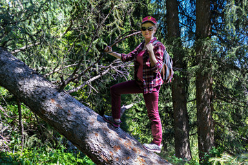 Girl walking on a fallen tree