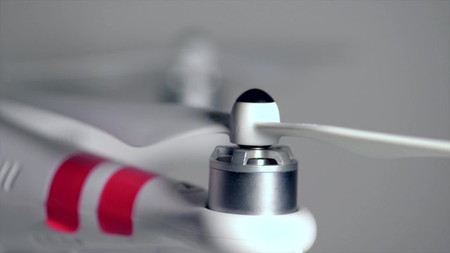 Quadcopter drone red lights blinking emergency close-up