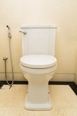 Modern and hygienic toilet bowl with bidet in bathroom