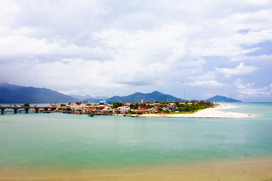 Lang Co beach, Hue province, Viet Nam. Lang Co is an attractive island-like stretch of palm-shaded white sand, with a turquoise lagoon on one side and 10km of beachfront on the other.