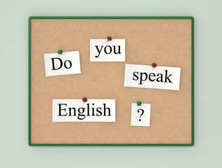 Cork board and sheets paper with the text Do you speak English?