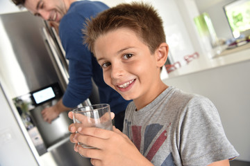 Young boy drinking fresh water - obrazy, fototapety, plakaty