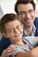 Young boy and daddy wearing eyeglasses