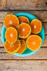 Sliced Orange fruit on wood table