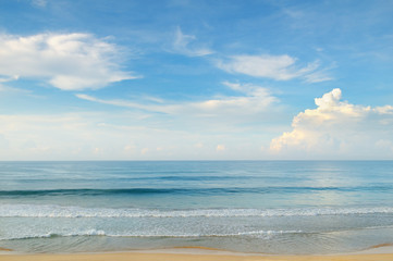 ocean, sandy beach and blue sky