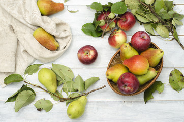 Apples and pears on a wooden table