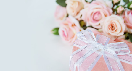 Festive composition with flowers and gift box