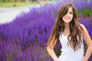 Cute smiling woman in park.