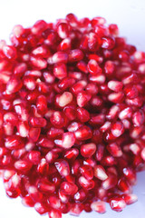 Juicy ripe seeds of pomegranate like natural background.
