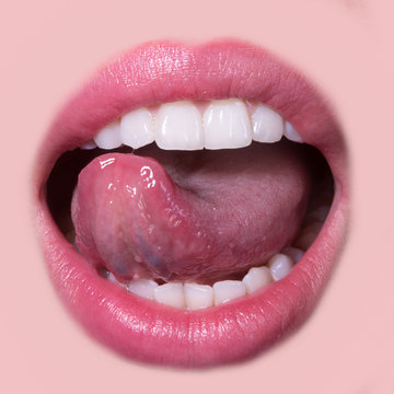 Closeup view of female smiling happy opne mouth with soft pink natural lips and white clean perfect healthy beautiful teeth and licking tongue on medical dental beige background, square picture
