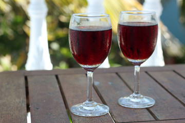 Two glasses with red wine on the table