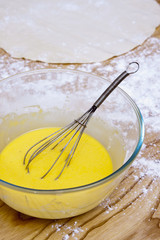 bowl with beaten egg on the kitchen table