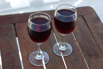 Two glasses with red wine on the table