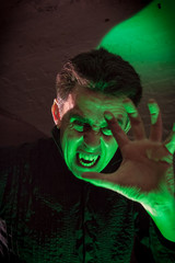 Vampire in his lair reaches out his hand towards the viewer