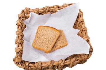 Wicker basket with roasted rye toasts.