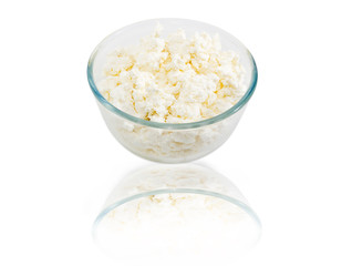 Cottage cheese in glass bowl on a light background