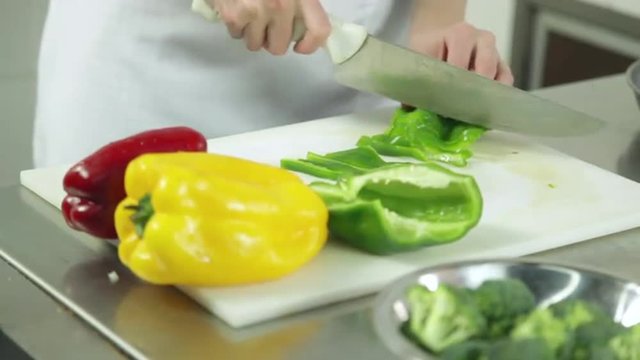 Woman cutting peppers