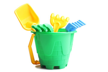 Kids toy bucket with shovel and rake isolated on white background