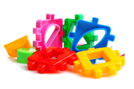 Baby sorter with geometric figures from plastic on a white isolated background